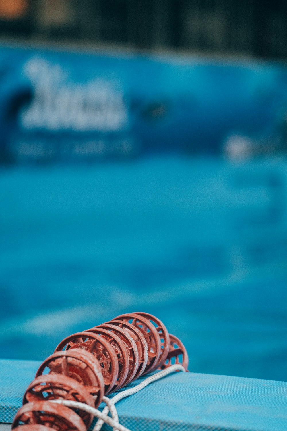 a close up of a tennis racket in a pool