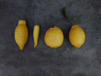an image showing four lemons in different shapes and sizes. Illustrates uniqueness of culture