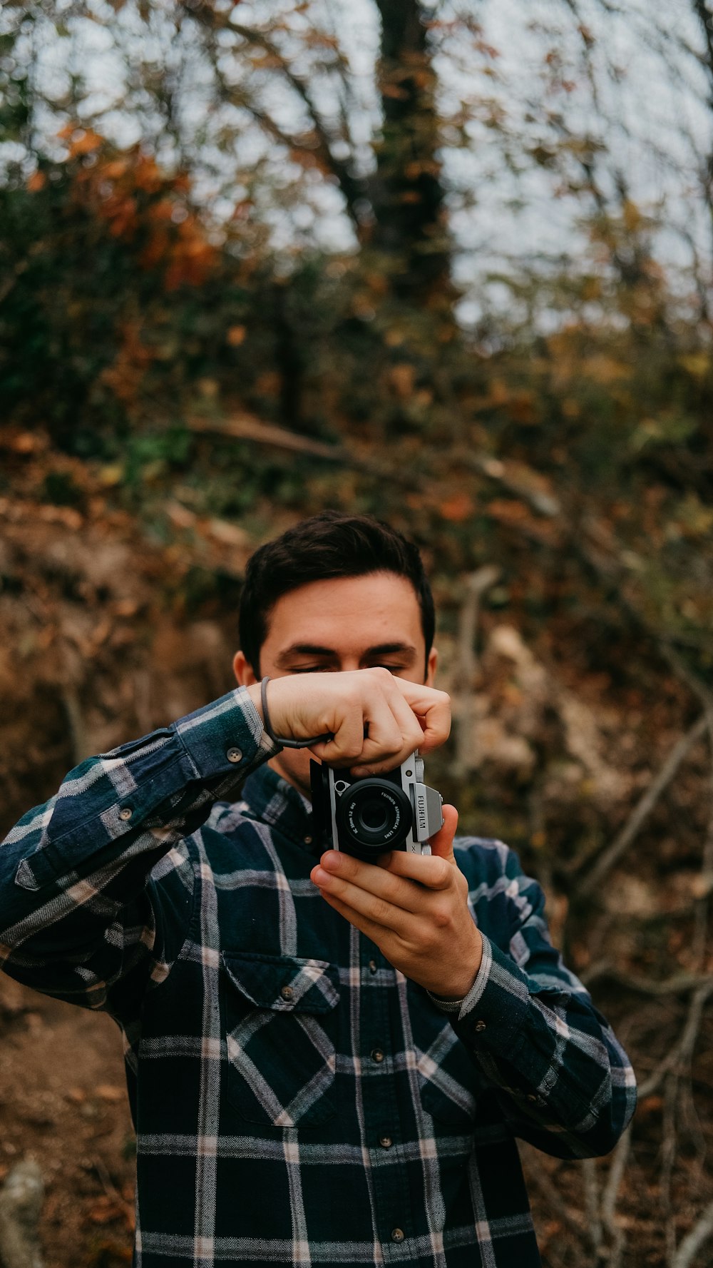 a man taking a picture of himself with a camera