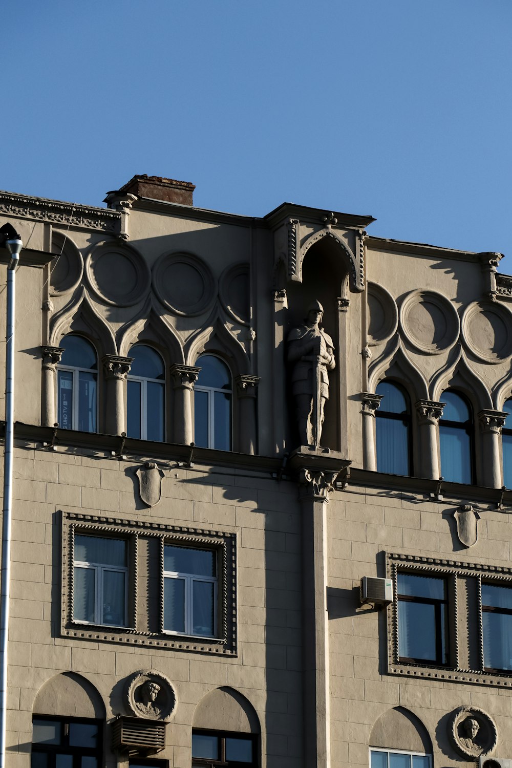 a tall building with a clock on the front of it