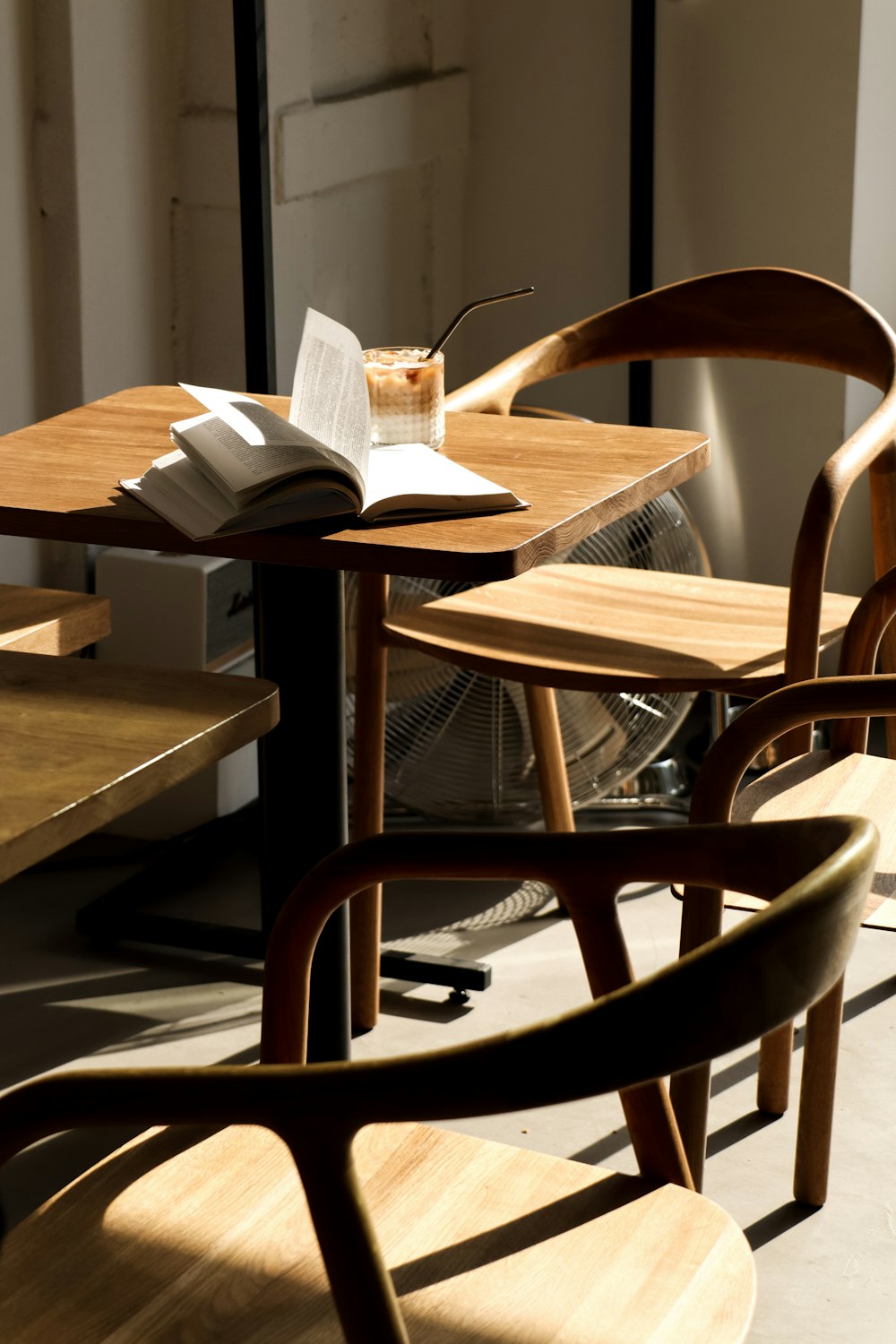 a couple of wooden chairs sitting next to each other