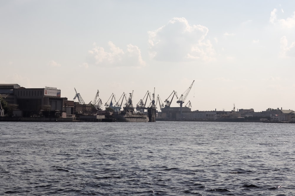 a large body of water with a bunch of ships in the background