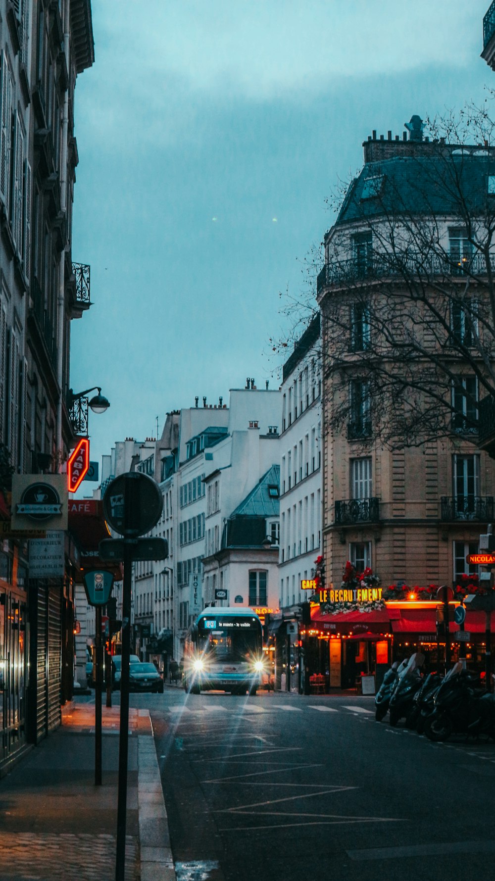 a city street filled with traffic and tall buildings