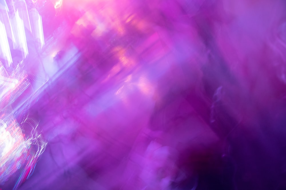 a blurry image of a purple and pink background