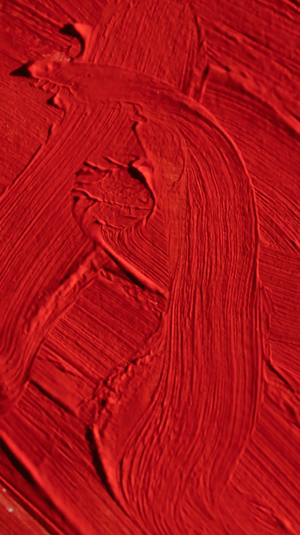 a close up view of a red paint