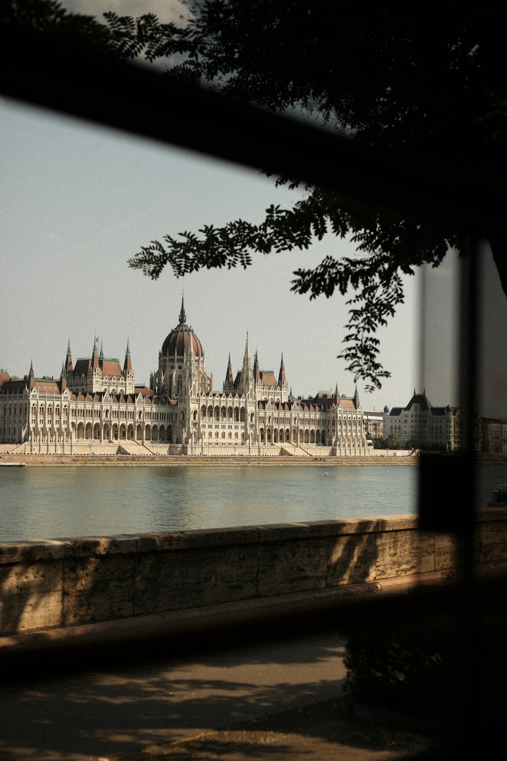 a view of a large building from across a river
