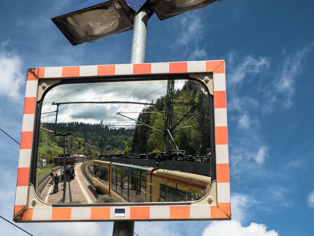 a reflection of a train in a mirror