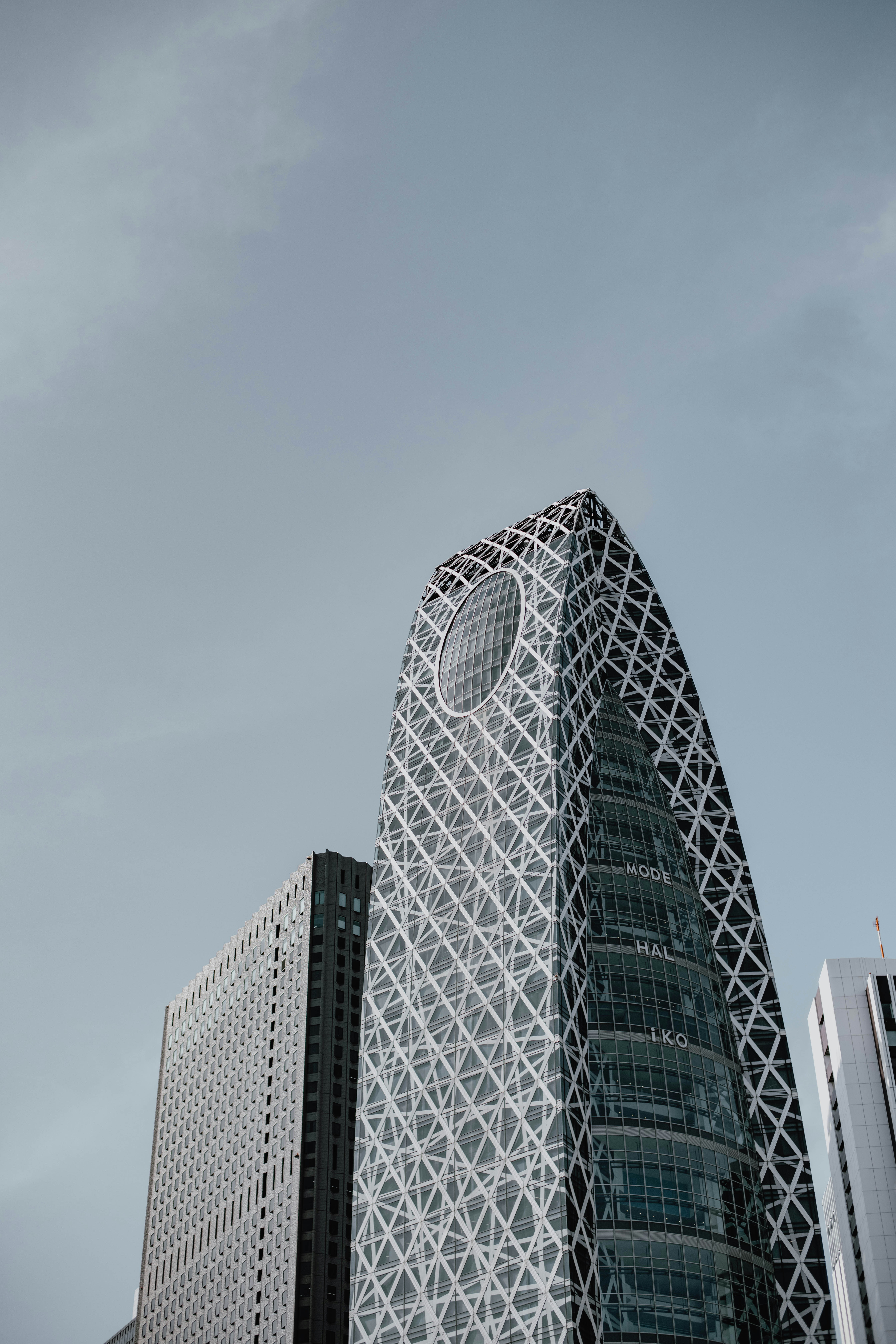 a very tall building with a clock on it's side