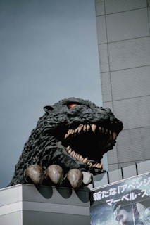 A playful Godzilla figure standing among toy buildings