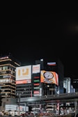 Nighttime cityscape featuring illuminated Northbridge Global Culinary signage.