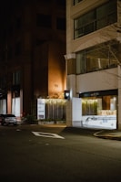 Nighttime outdoor lighting installed at a Kingsburg business entrance.