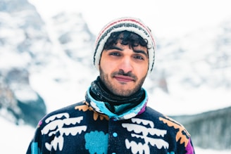 Person wearing a warm handmade jacket in an outdoor winter setting.