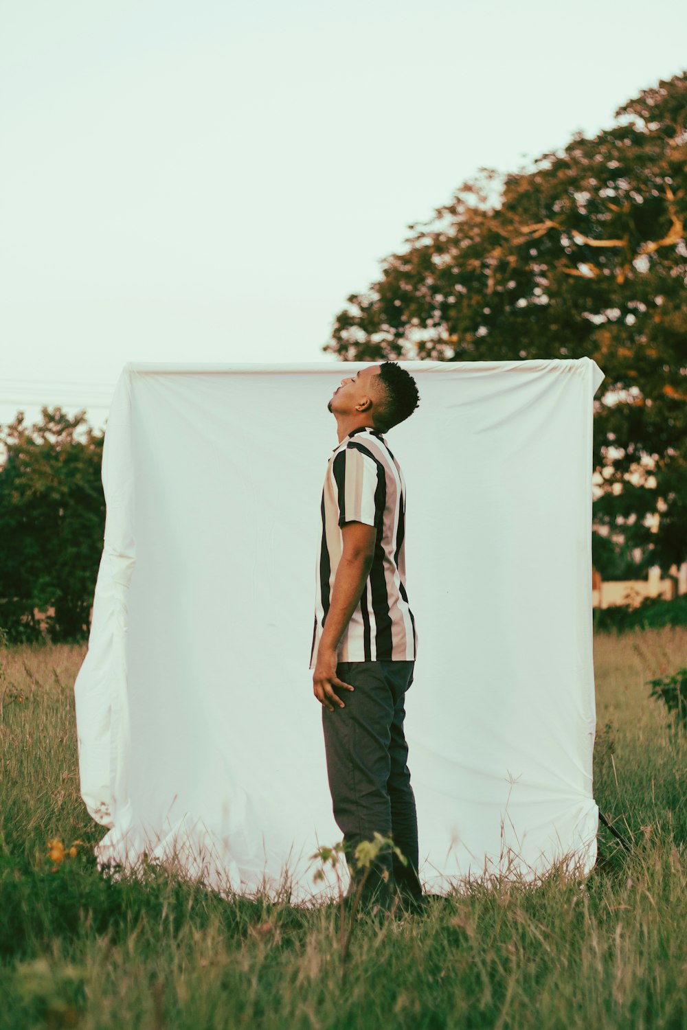 a man standing in front of a white backdrop