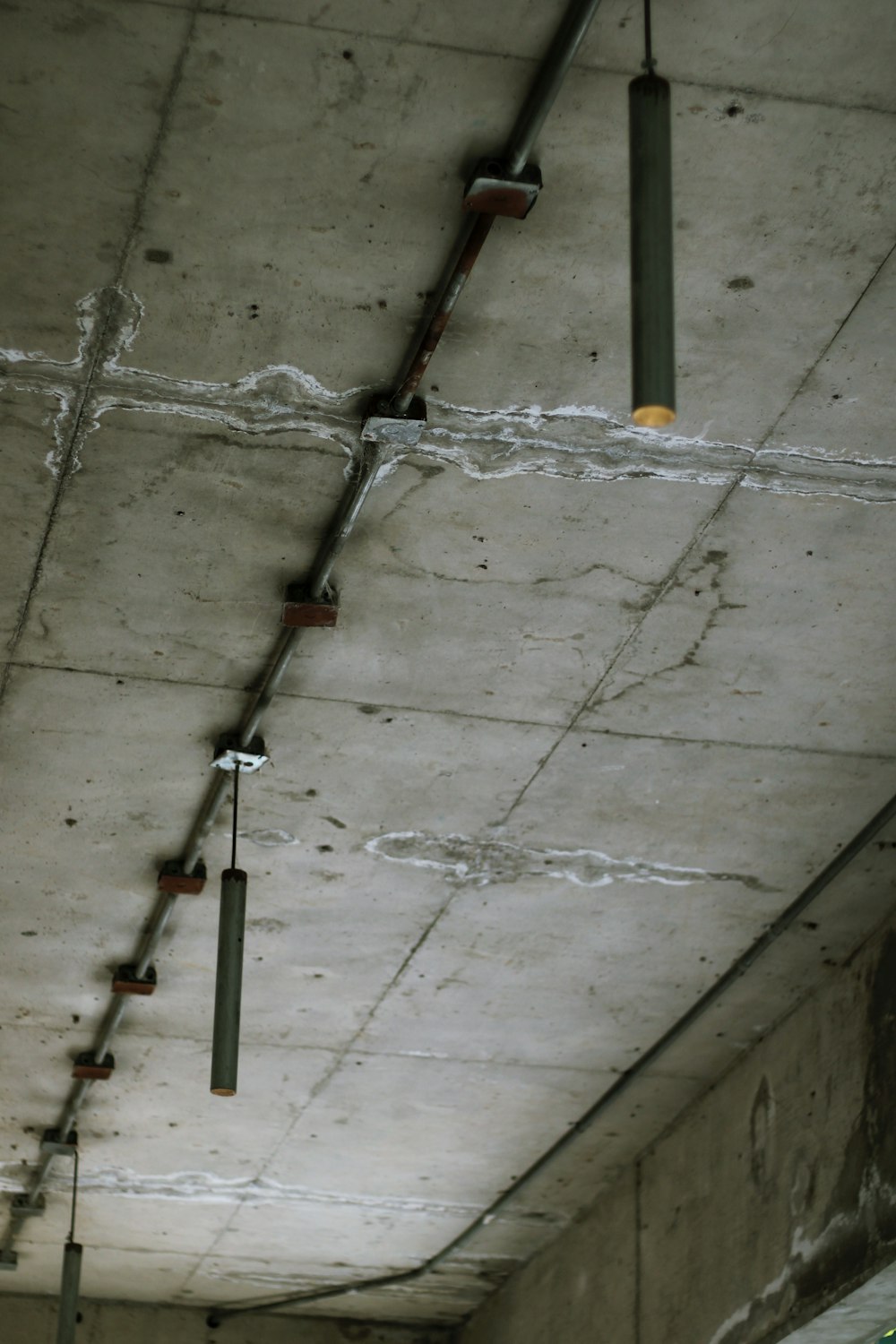 a fire hydrant in the middle of a concrete ceiling