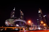 Nighttime cityscape featuring Contra Middle East’s illuminated mixed-use development.