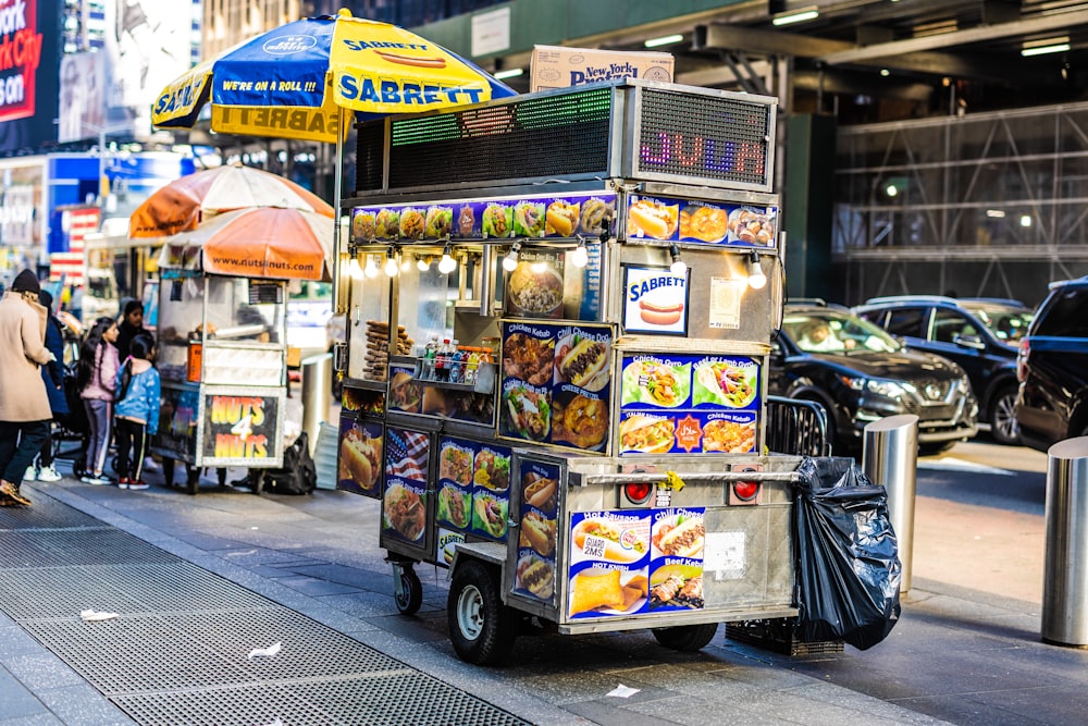 a food cart parked on the side of a street