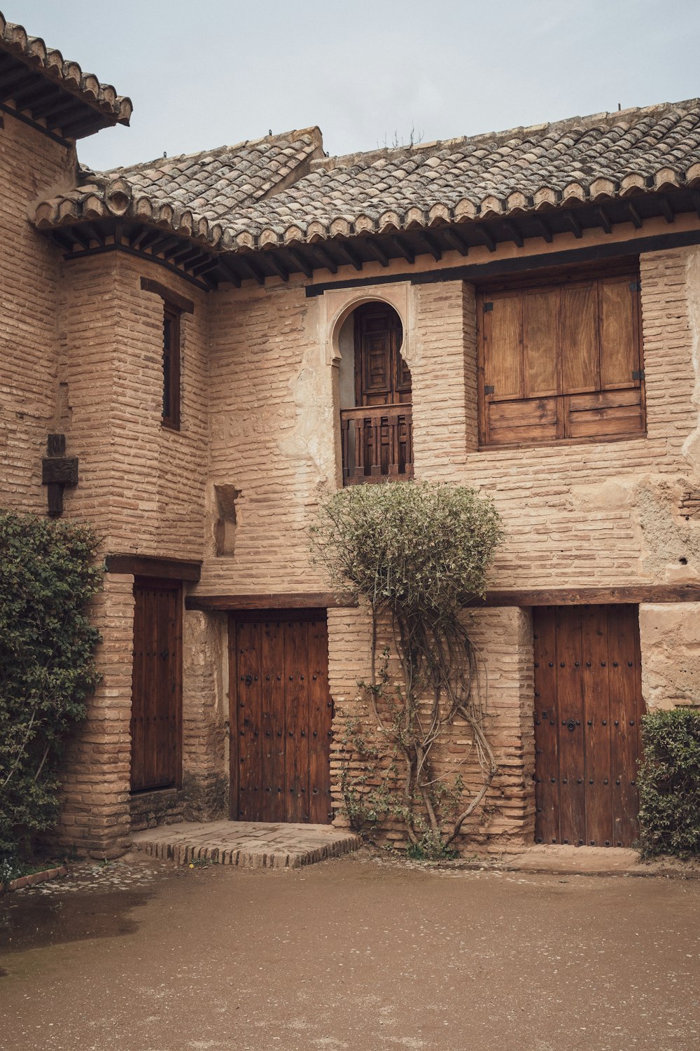 a building with two doors and a window