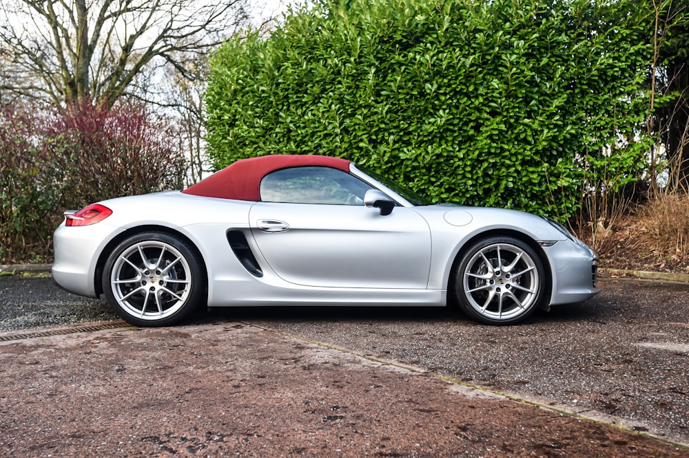 a silver sports car parked in a parking lot