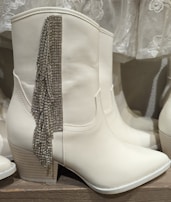 Elegant high-fashion boots with intricate designs inspired by Alexander McQueen and Maria Antoinette.