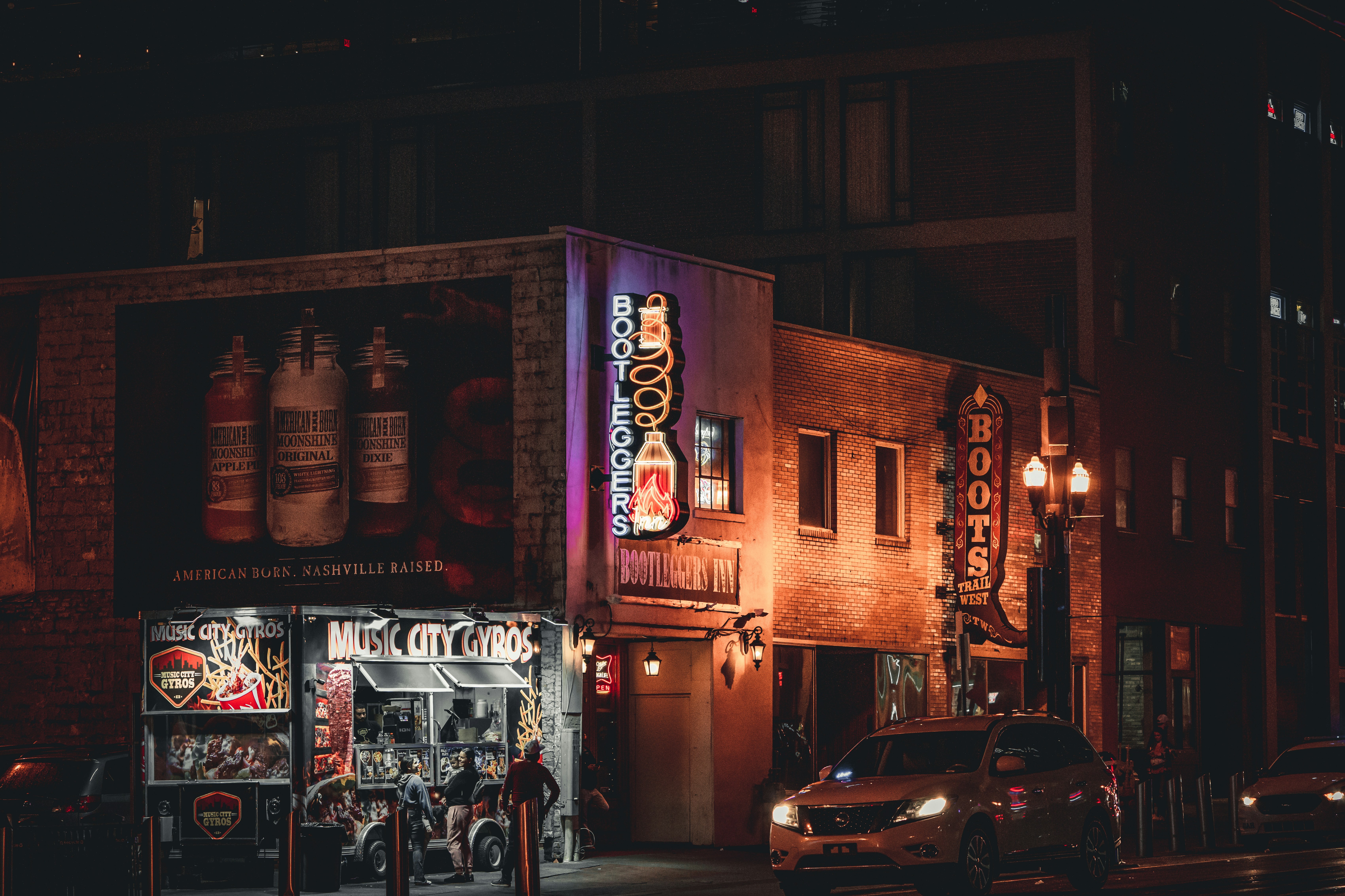a building with a neon sign on the side of it