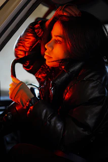Driver in a rugged jacket stepping into the cab, framed by the warm glow of a setting sun.