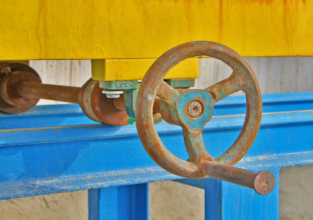 a close up of a blue and yellow bench