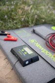 A minimalist solar energy control system panel with clear digital displays