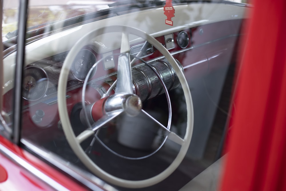 a close up of a car's steering wheel and dashboard