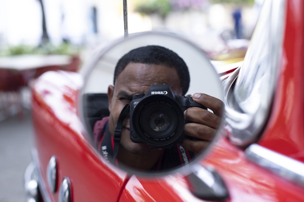 a man taking a picture of himself in a mirror