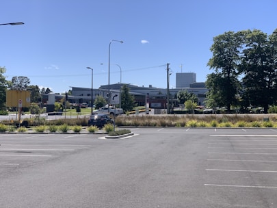 A spacious parking lot with clearly marked spaces for cars.