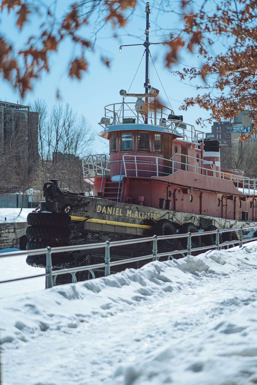 a large boat sitting on top of snow covered ground