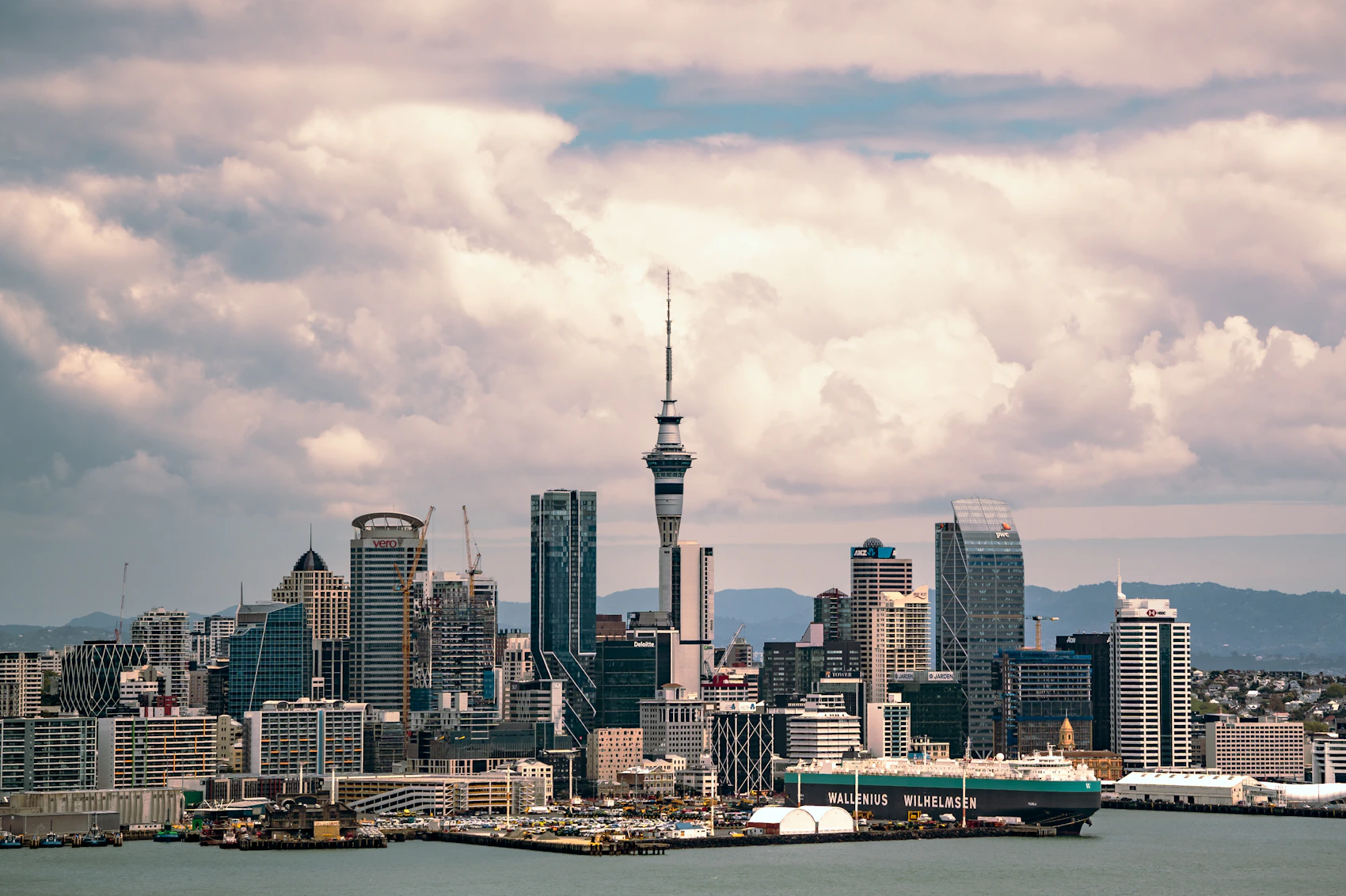 Auckland skyline and Sky Tower beside the harbour