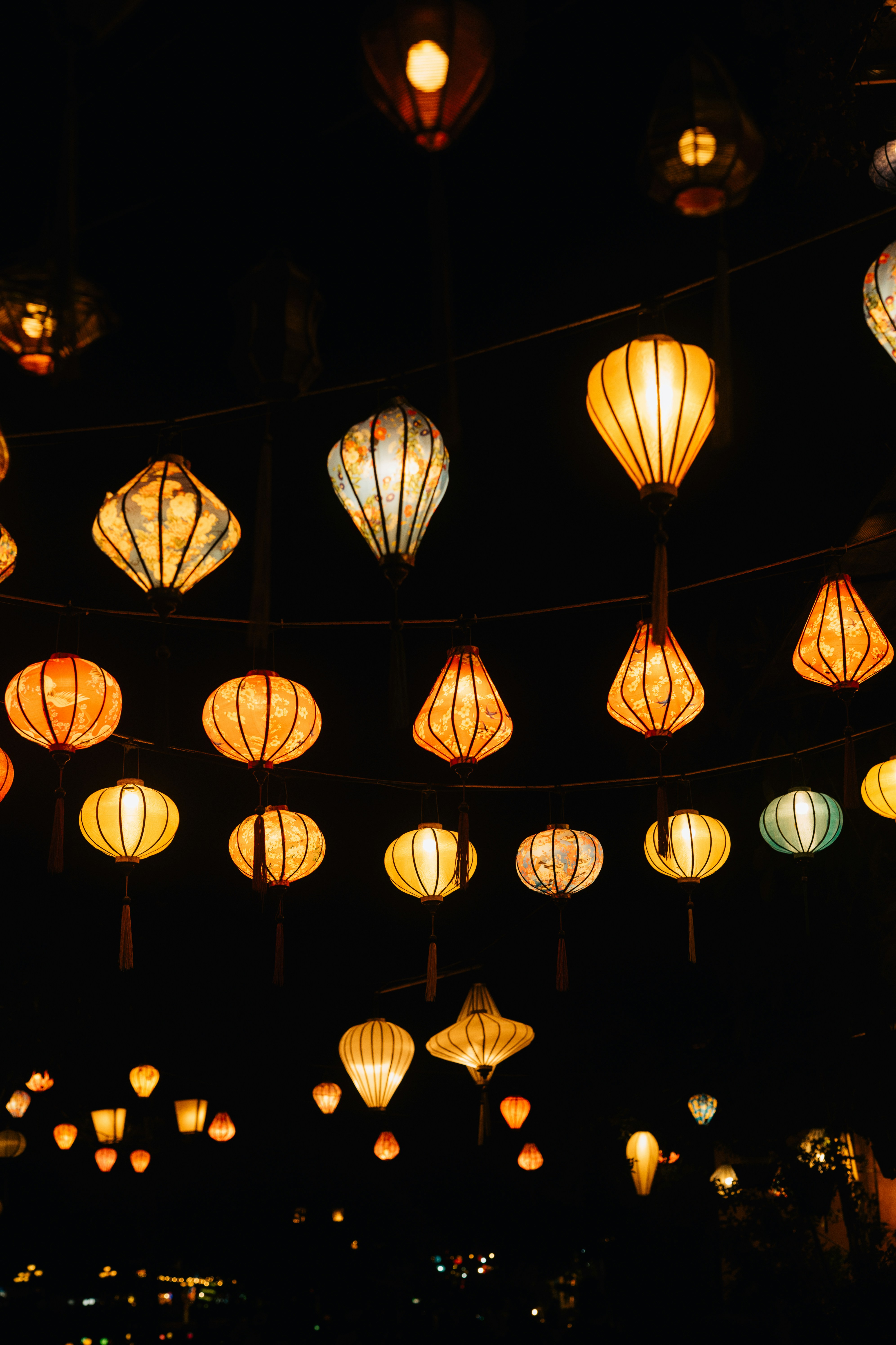 A bunch of lights that are hanging in the air photo Free Hoi an