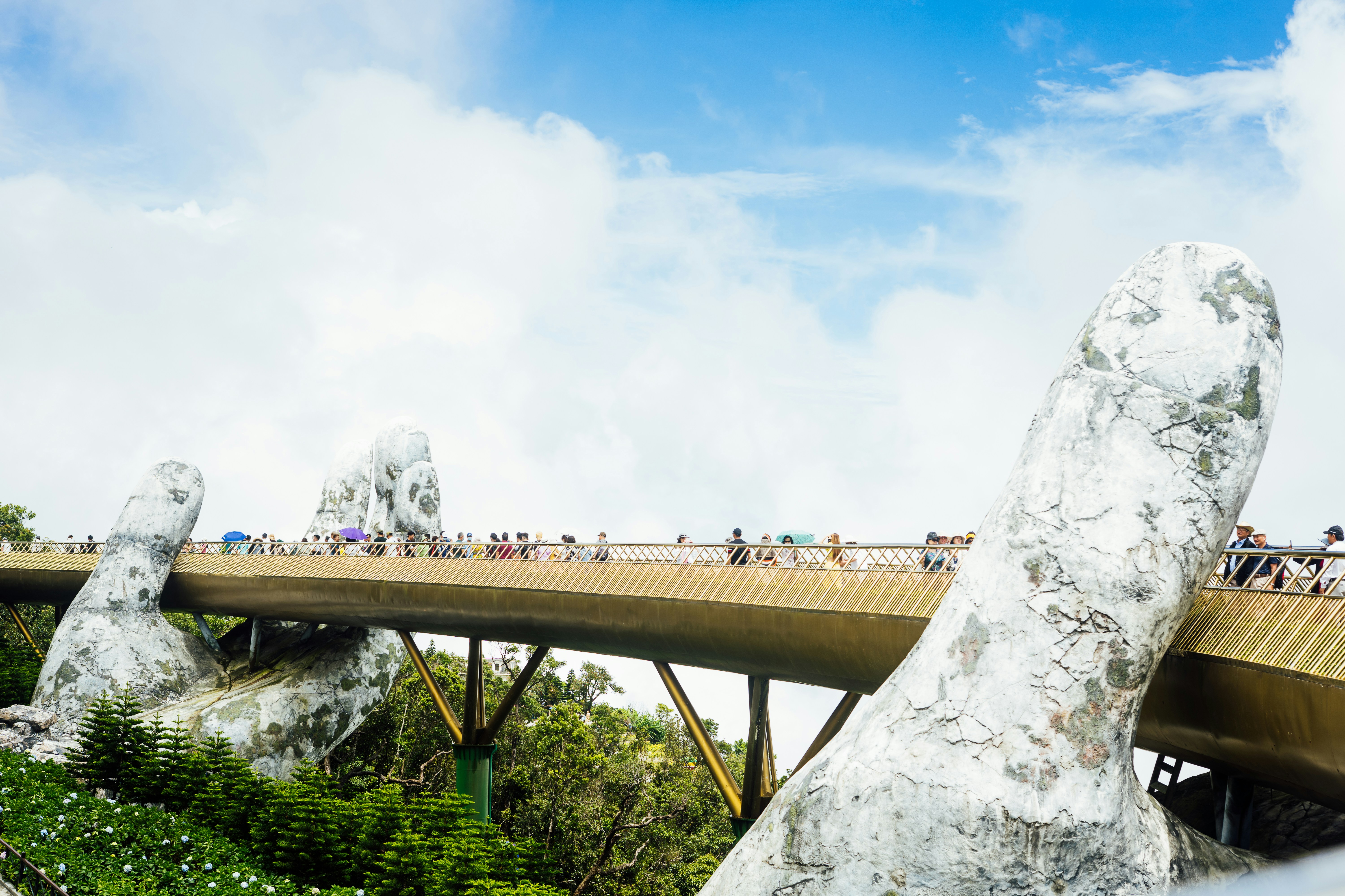 a bridge over a river with people walking on it