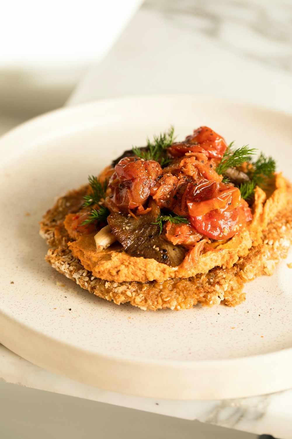 a white plate topped with food on top of a table