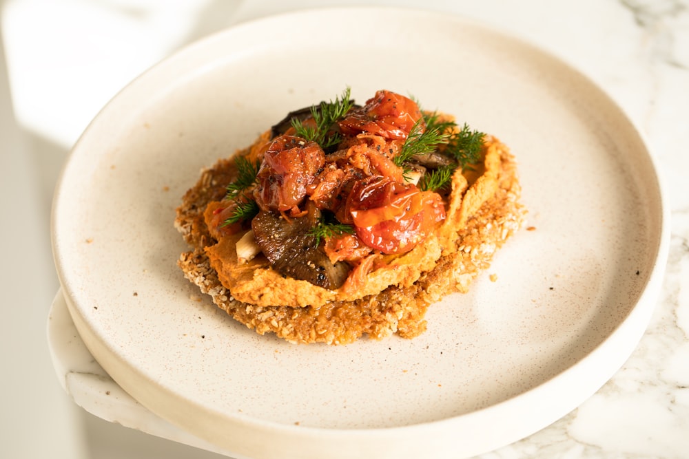 a white plate topped with food on top of a table