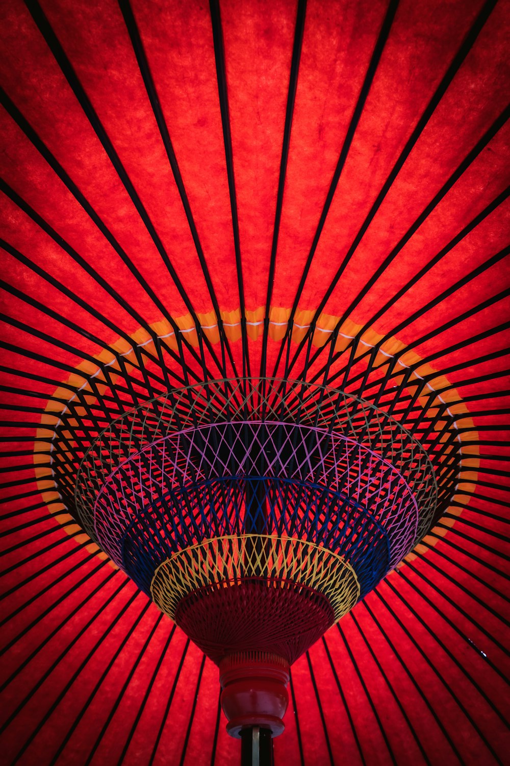 a close up of a red and yellow umbrella