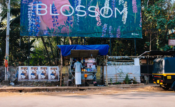 a street scene with a bus and a billboard
