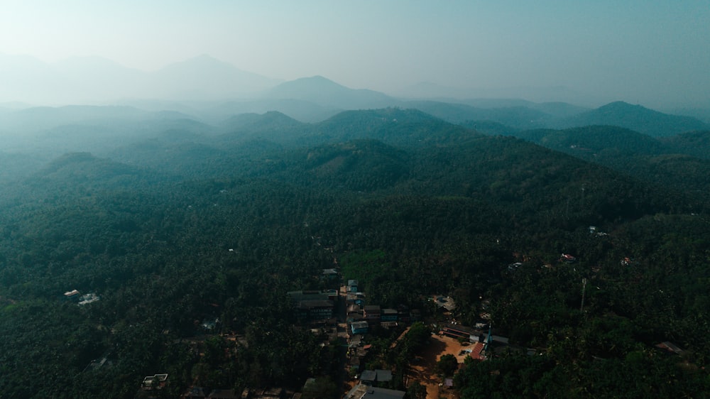 an aerial view of a village in the mountains