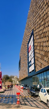 Exterior shot of a modern retail building with clear signage and steady foot traffic.