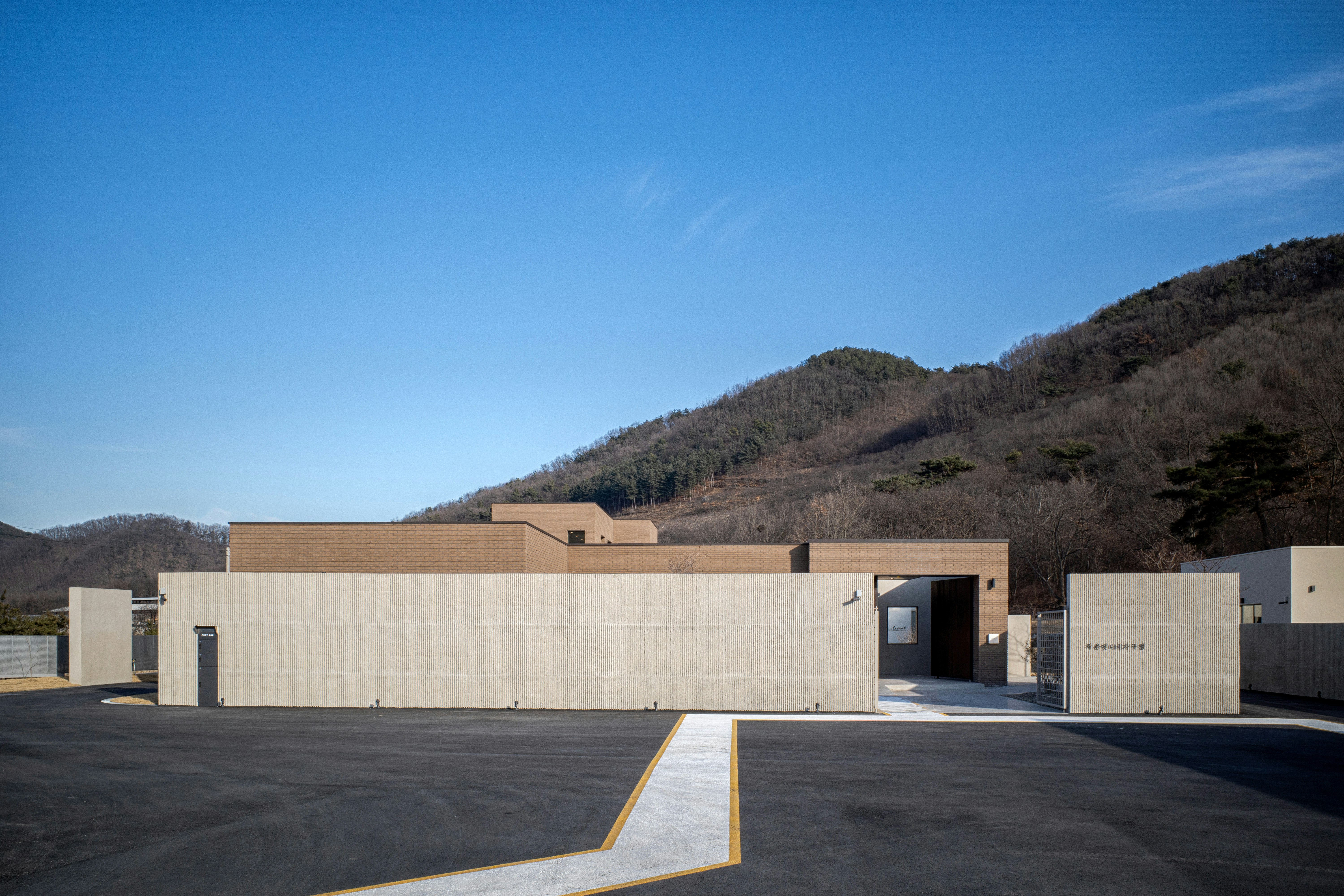 an empty parking lot in front of a building