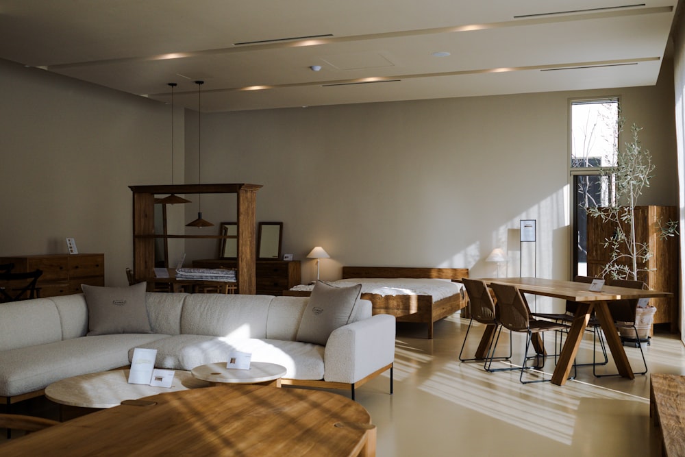 a living room filled with furniture and a large window