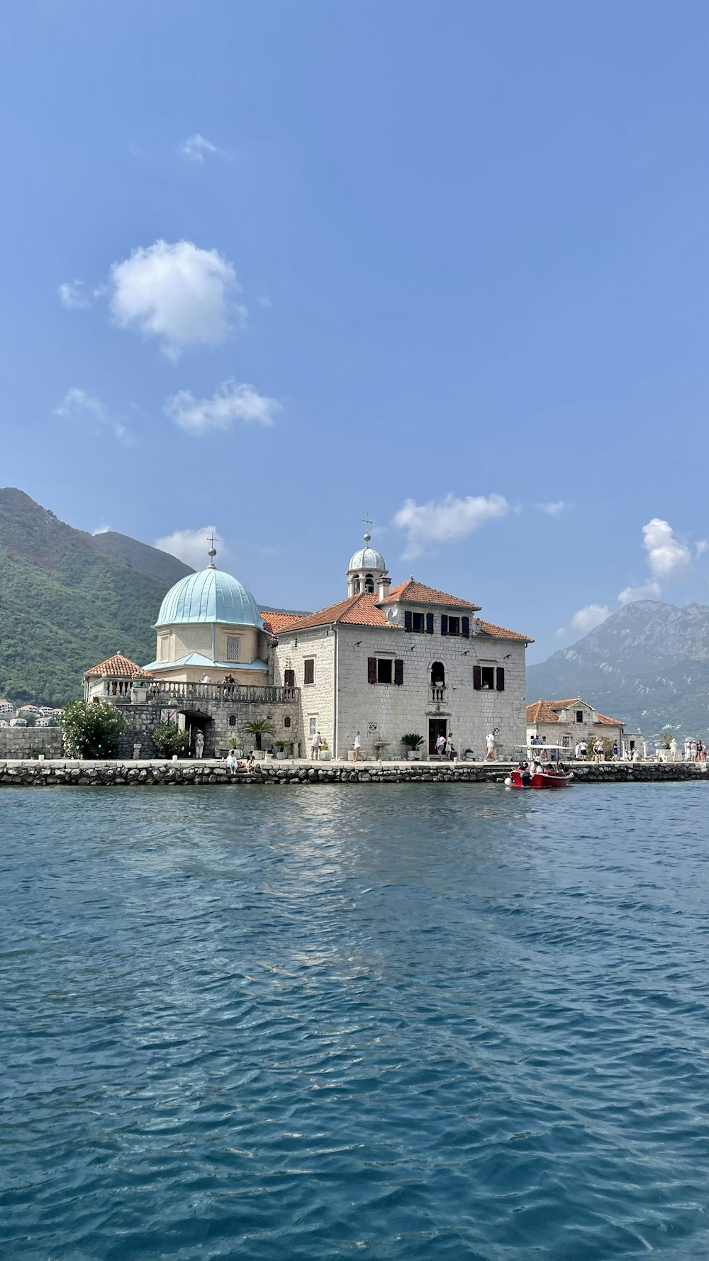 a large building sitting on top of a body of water