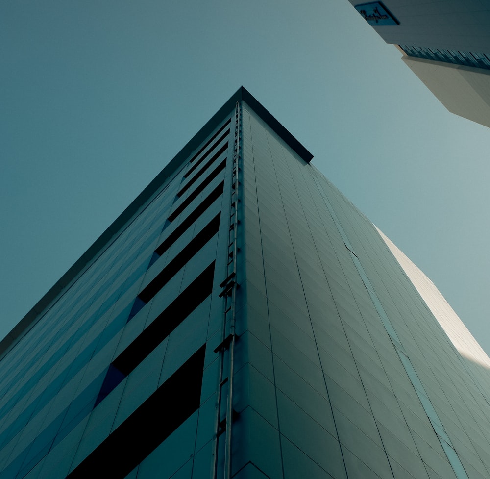 a tall building with a sky background