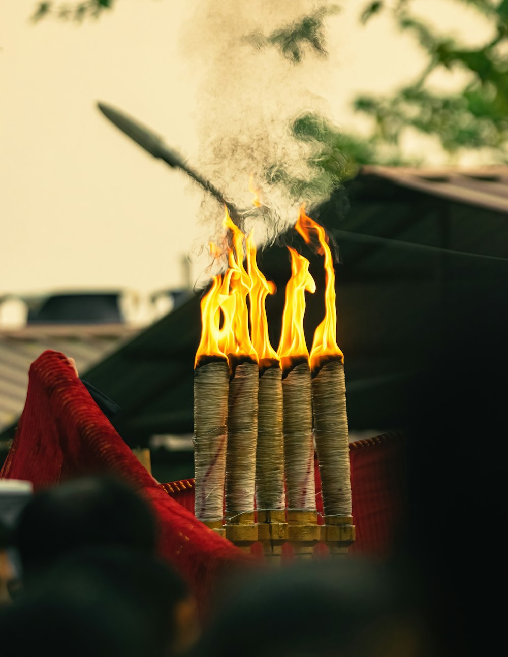 a bunch of fire sticks that are on a table