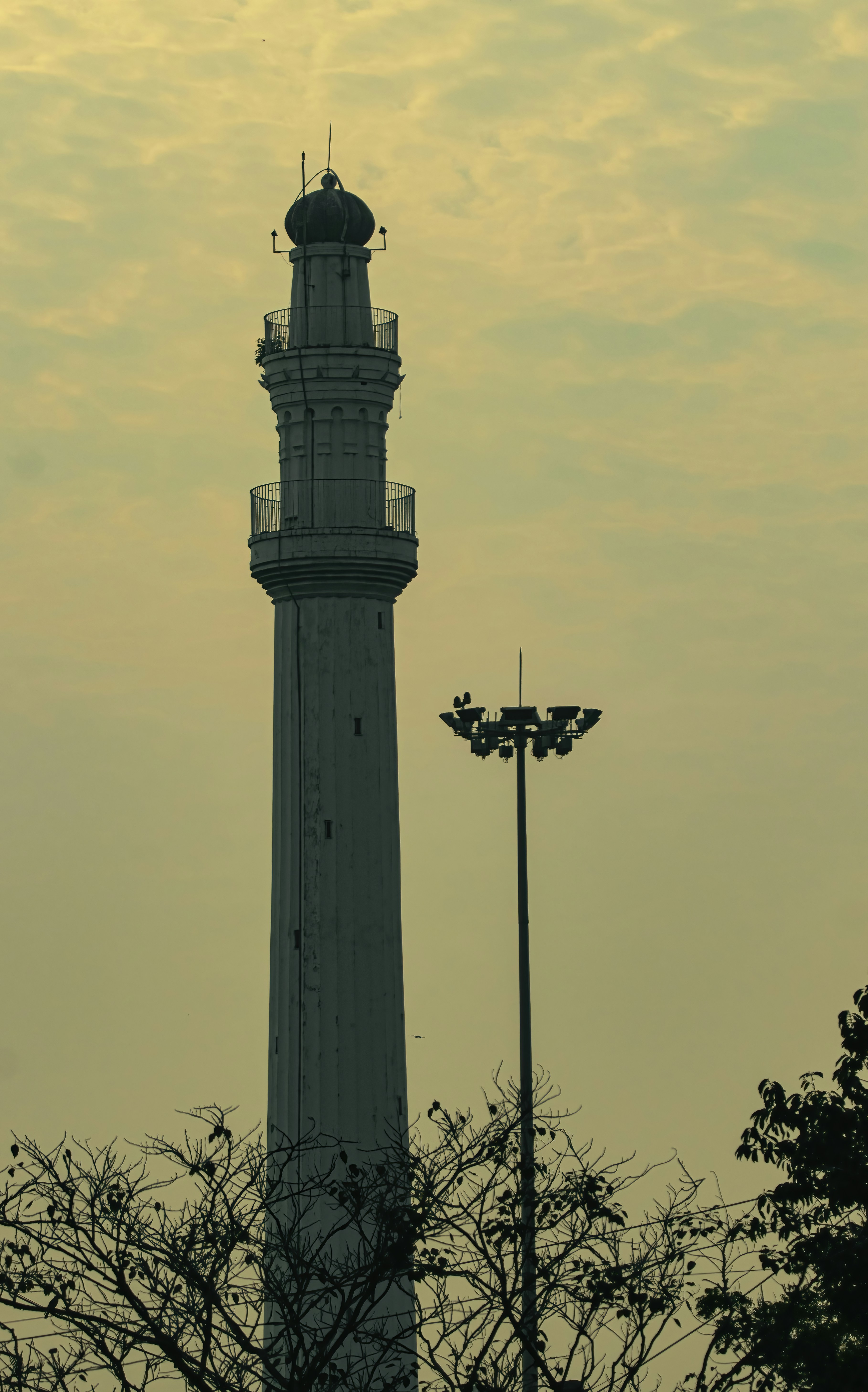 a tall tower with a clock on top of it