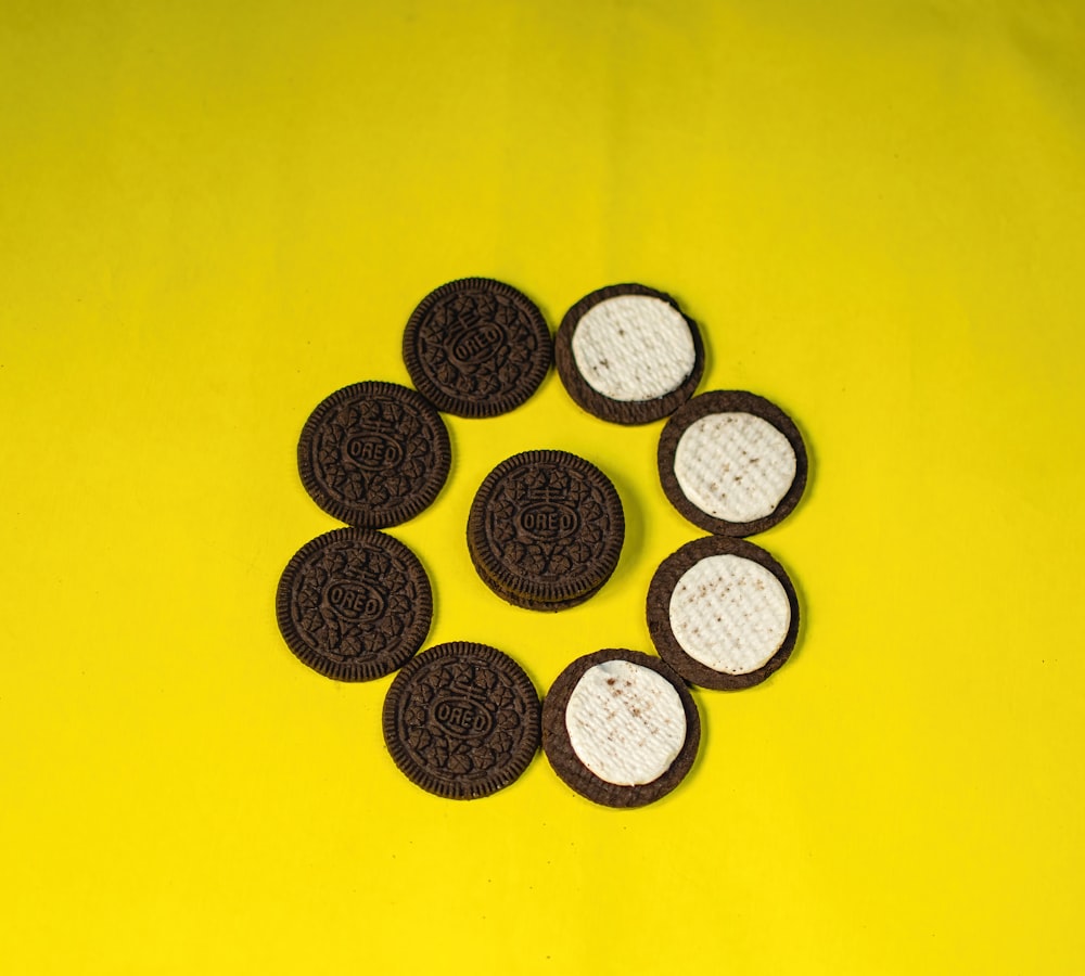 a group of oreo cookies sitting on top of a yellow table