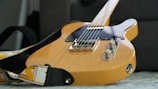 Classic Fender Telecaster with a creamy yellow finish and relic paint details.