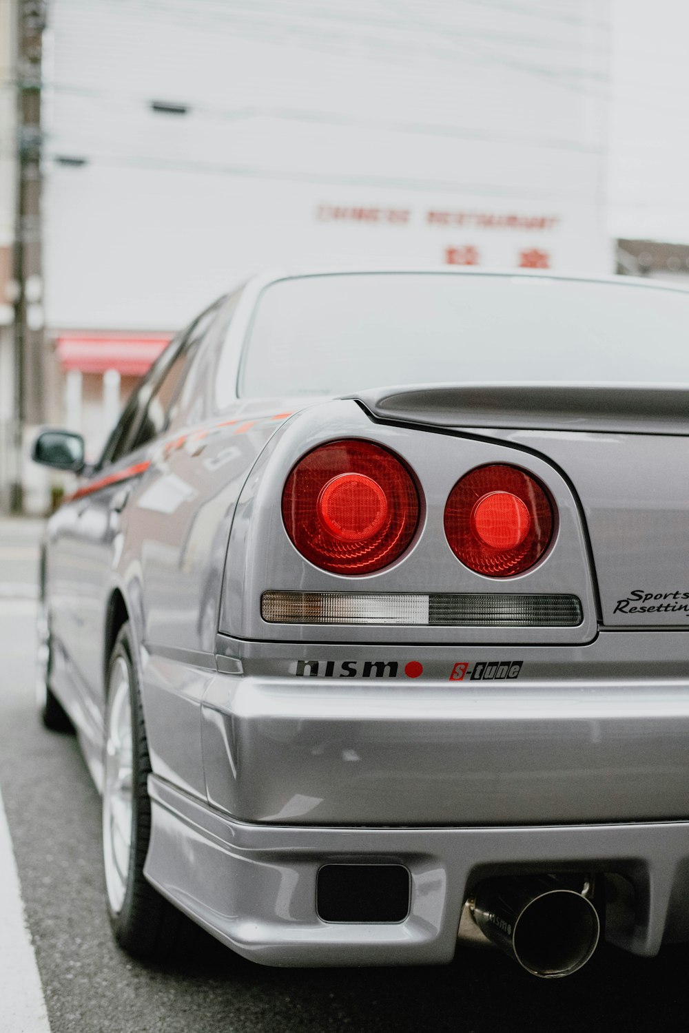 a silver car parked on the side of the road