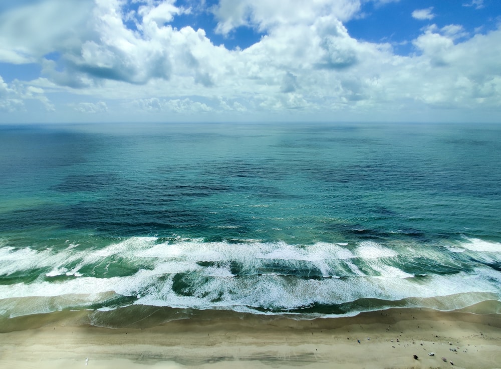 a view of the ocean from the top of a hill